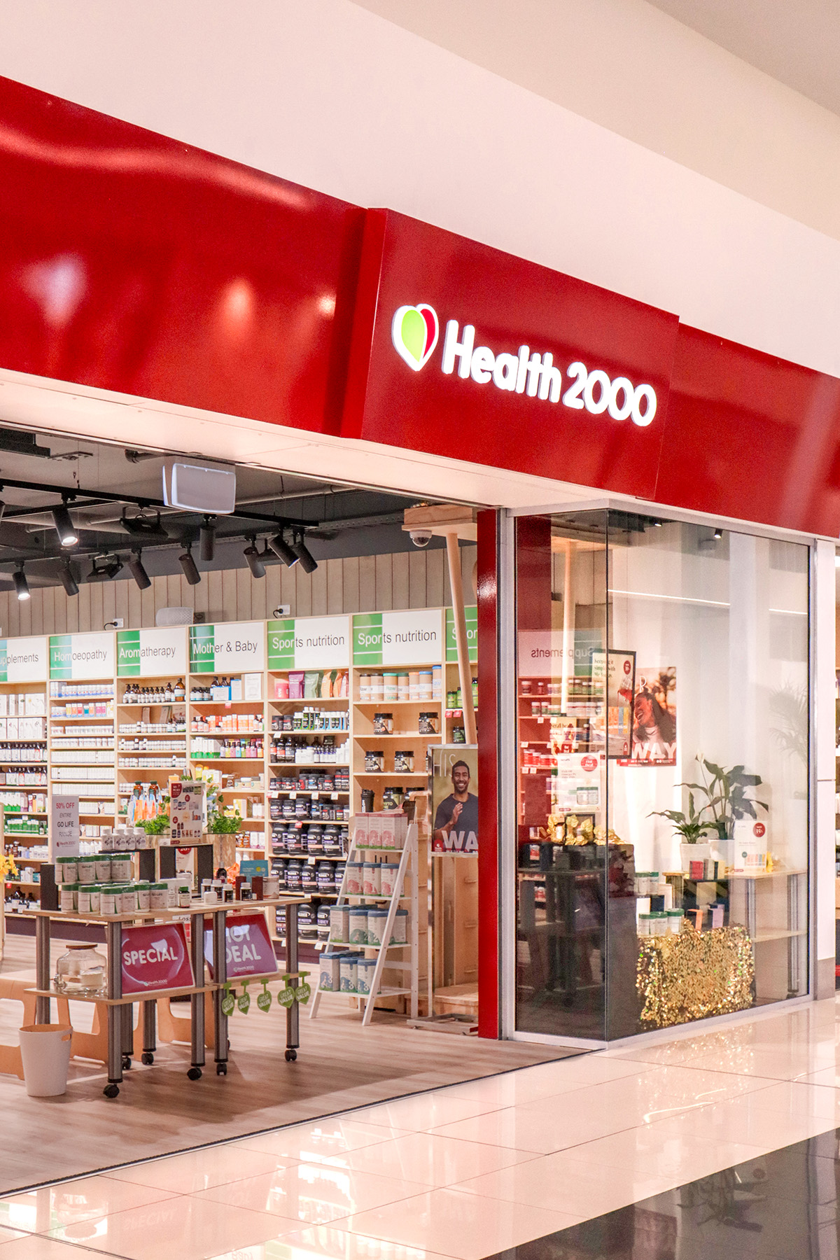 Reception area of a nail salon with bench seating along the wall. 