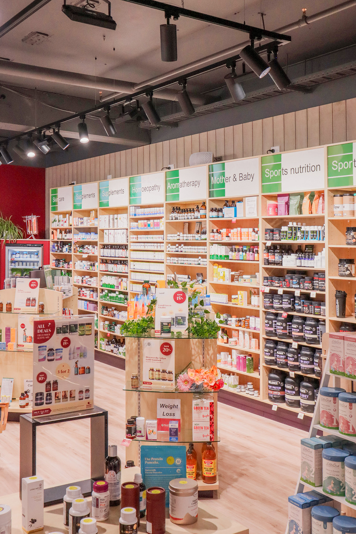 Reception area of a nail salon with bench seating along the wall. 