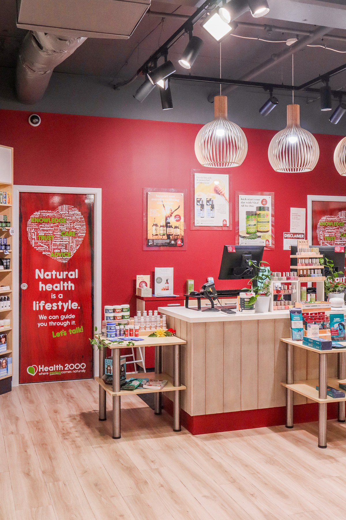 Basin with wooden cupboard fronts and featured wall in a new retail interior fitout.