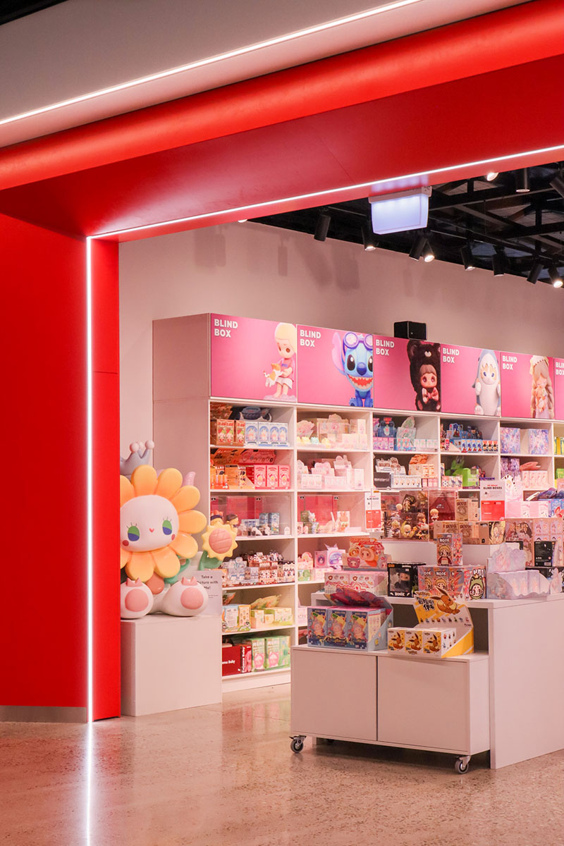 Basin with wooden cupboard fronts and featured wall in a new retail interior fitout.