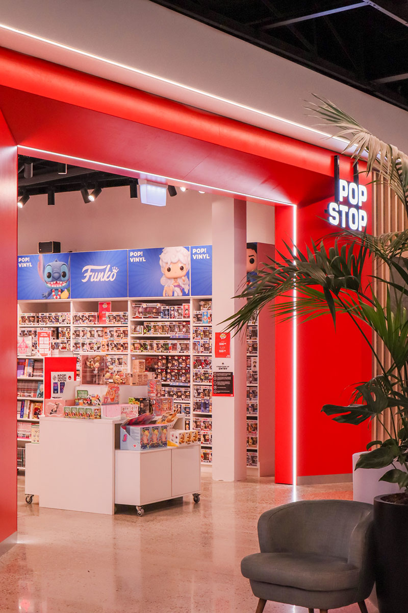 Reception area of a nail salon with bench seating along the wall. 