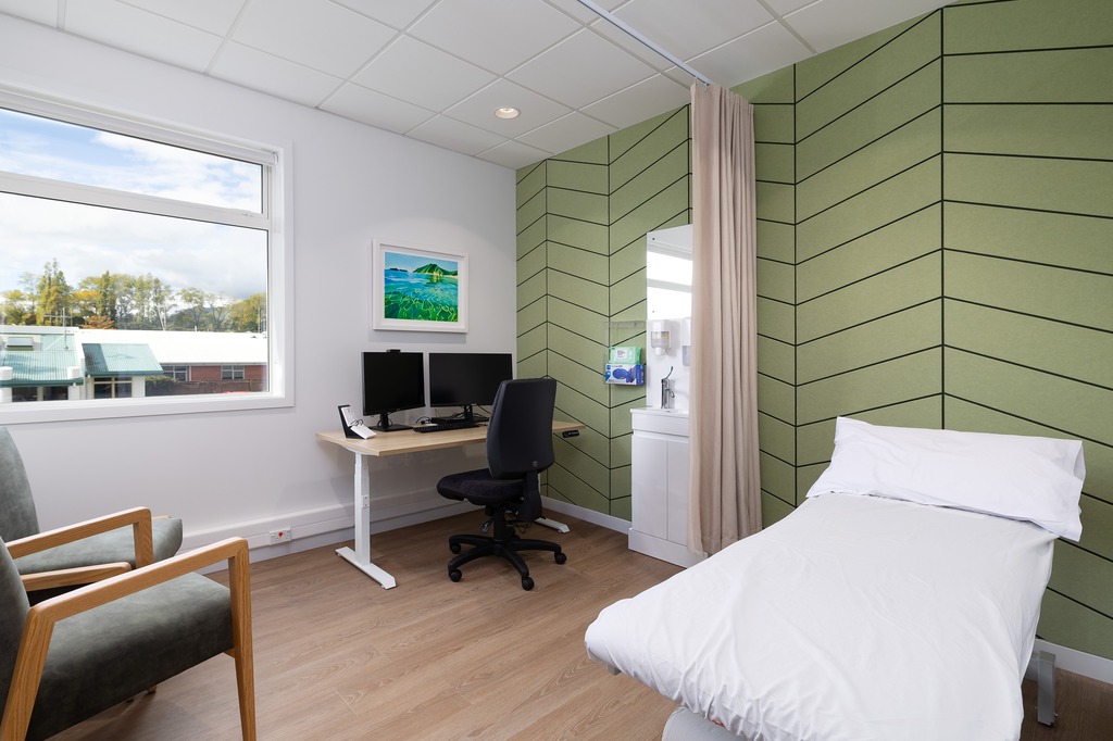Reception area of a nail salon with bench seating along the wall. 