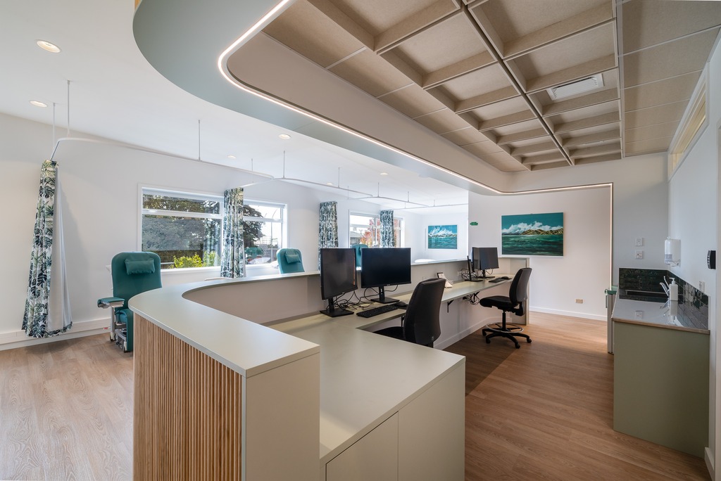 Basin with wooden cupboard fronts and featured wall in a new retail interior fitout.