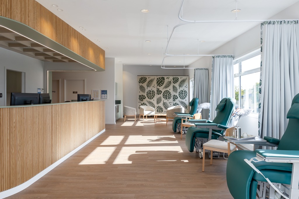 Basin with wooden cupboard fronts and featured wall in a new retail interior fitout.