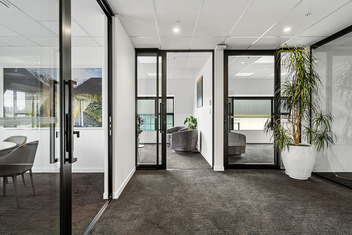 Reception area of a nail salon with bench seating along the wall. 